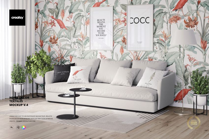 Home decor textiles PSD mockup featuring a neutral sofa, botanical wallpaper, and minimalist coffee tables.