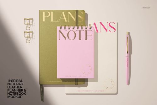 PSD mockup of a stationery set including a pink spiral notepad, green planner, white notebook, and matching pen.