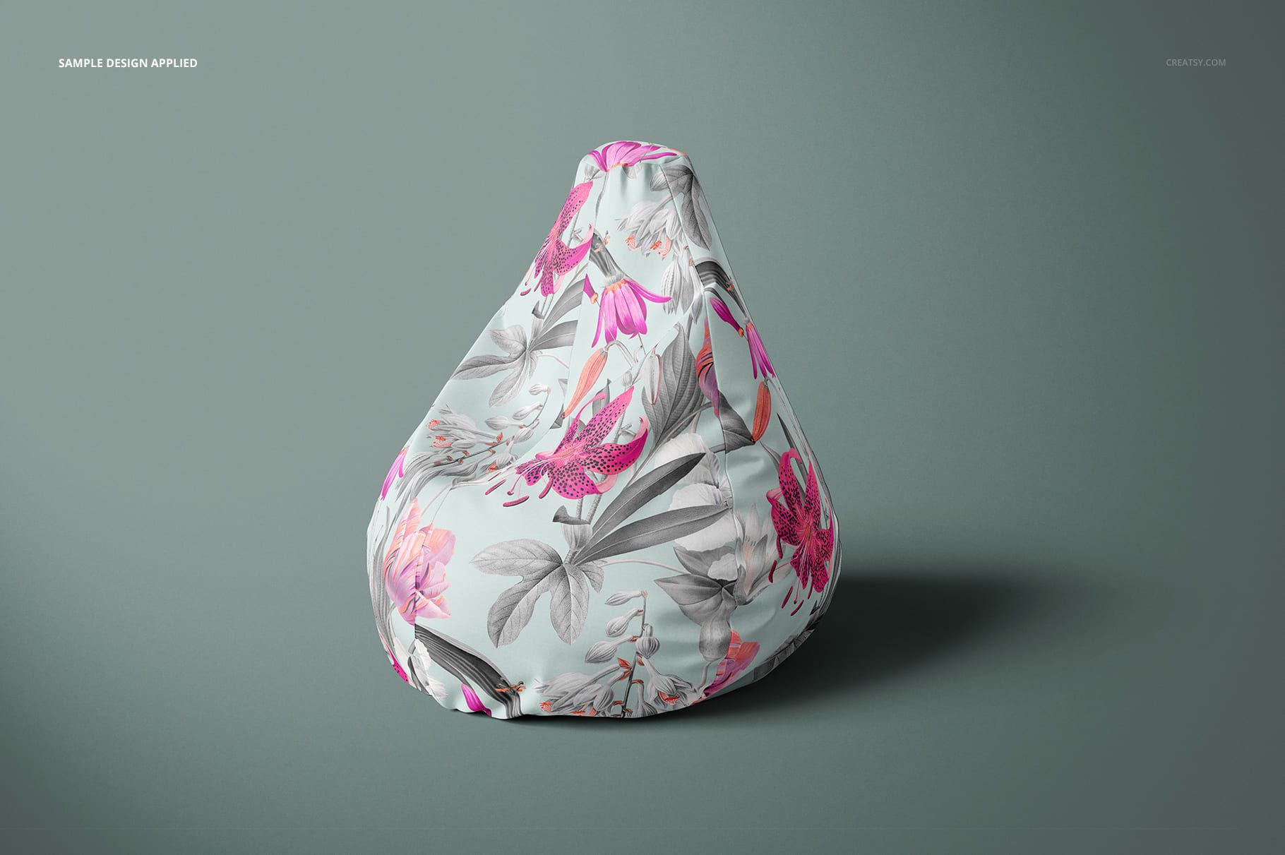 All-over print bean bag chair mockup featuring pink and gray botanical patterns, displayed on a neutral surface.