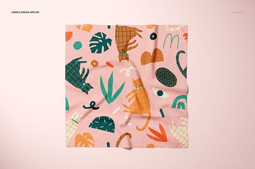 Pet bandana mockup featuring a soft pink fabric with whimsical cats and geometric patterns, shown from a top view.
