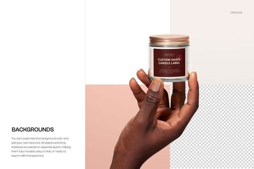 Close-up of a clear glass candle jar mockup in hand, featuring a custom label and rose gold lid on a modern backdrop.