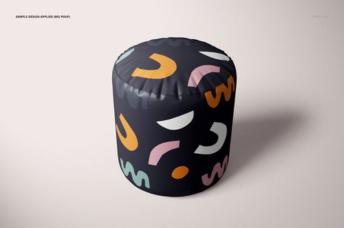 PSD mockup of a pouf in a home setting, with colorful geometric patterns on a dark fabric, viewed from the side.
