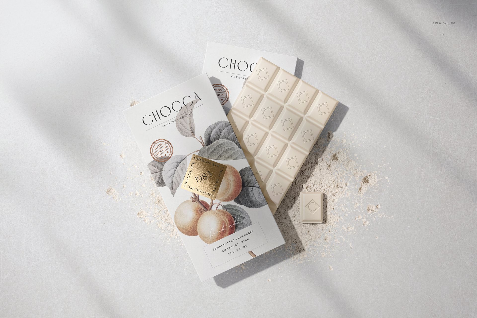 Front view of chocolate bar packaging mockup with botanical illustration, white chocolate bar and powder on light surface.