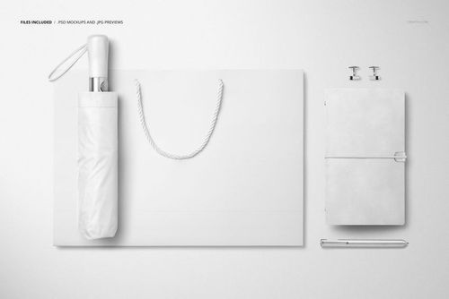 Top-down scene showing a white umbrella, shopping bag with rope handles, notebook, pen, and cufflinks mockup.