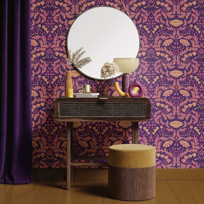 Dressing table mockup showing a wooden table with decorative objects, a round mirror, and a patterned wallpaper backdrop.