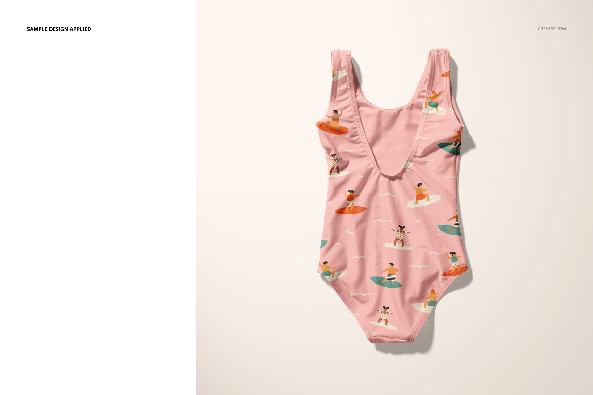 Front view of a baby swimsuit mockup featuring a pink fabric with playful surfing dog illustrations on a neutral background.