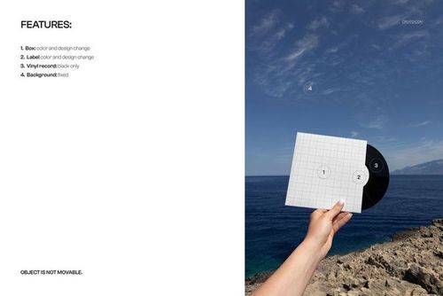 Hand holding a black vinyl record mockup with a square cover against a clear blue sky and sea background.