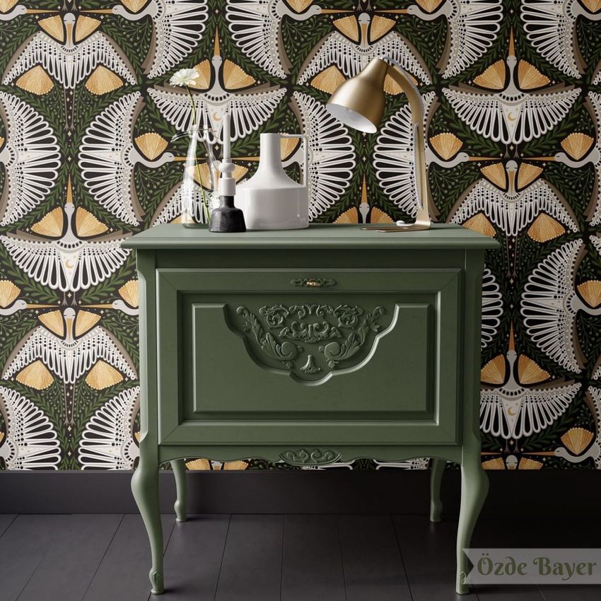 Interior scene mockup showing a green vintage-style cabinet against a patterned wallpaper with white and gold crane motifs.