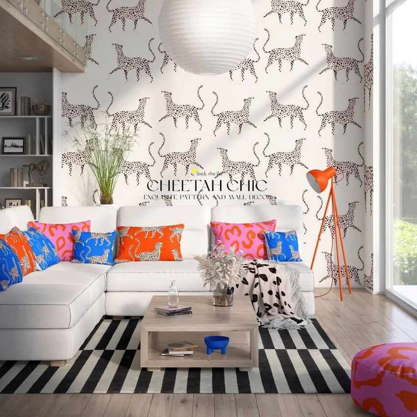 Modern living room mockup featuring cheetah print wallpaper, bright patterned pillows, and a cozy seating area with decor accents.