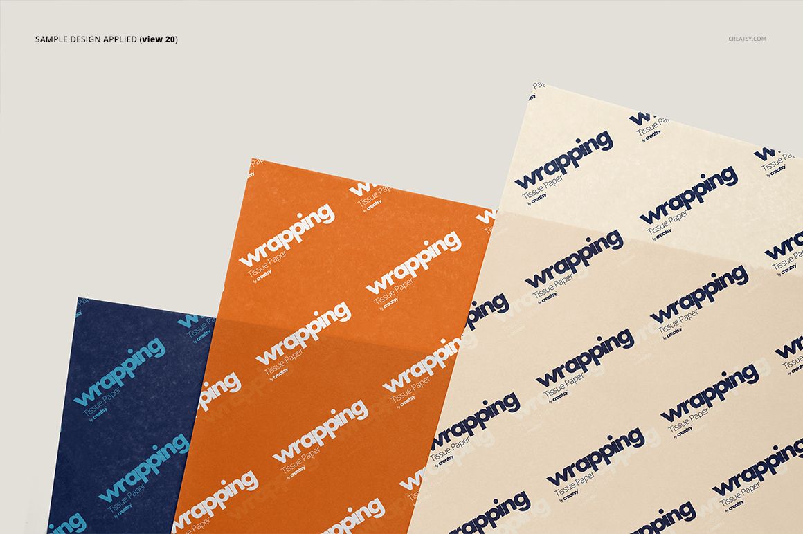 Three sheets of wrapping tissue paper mockup displayed at an angle, featuring blue, orange, and beige colors with repeating text.