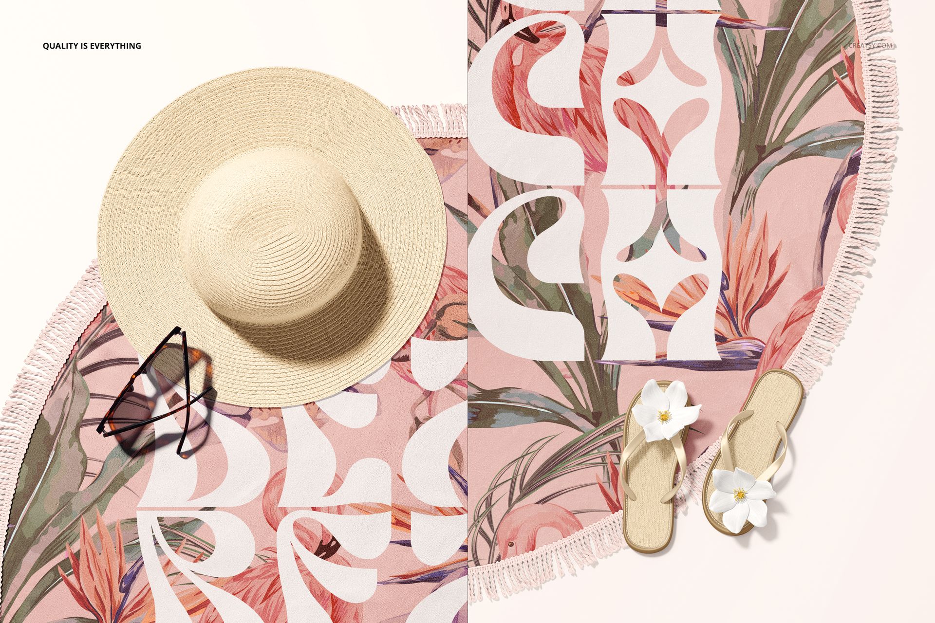 Top view of a round tassel fringe beach towel mockup with bold white lettering, sunglasses, hat, and sandals nearby.