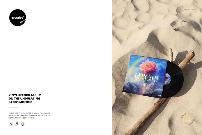 PSD mockup showing a vinyl record and album cover resting on textured sandy surface with a branch nearby.