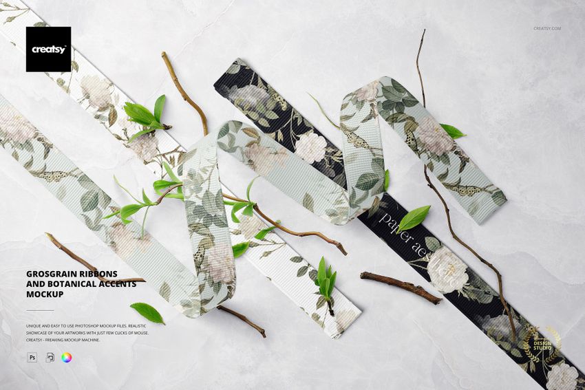 Assorted grosgrain ribbons featuring botanical designs displayed with branches and foliage in a PSD mockup scene.