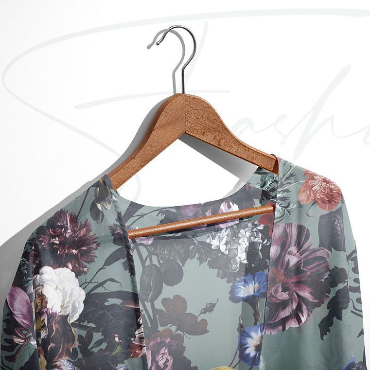 Chiffon kimono mockup featuring a floral pattern in muted colors, displayed on a wooden hanger against a light background.