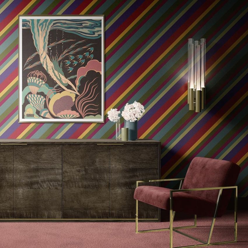 Armchair and sideboard mockup in a modern interior with a striped wall, framed artwork, and a vase of white flowers.