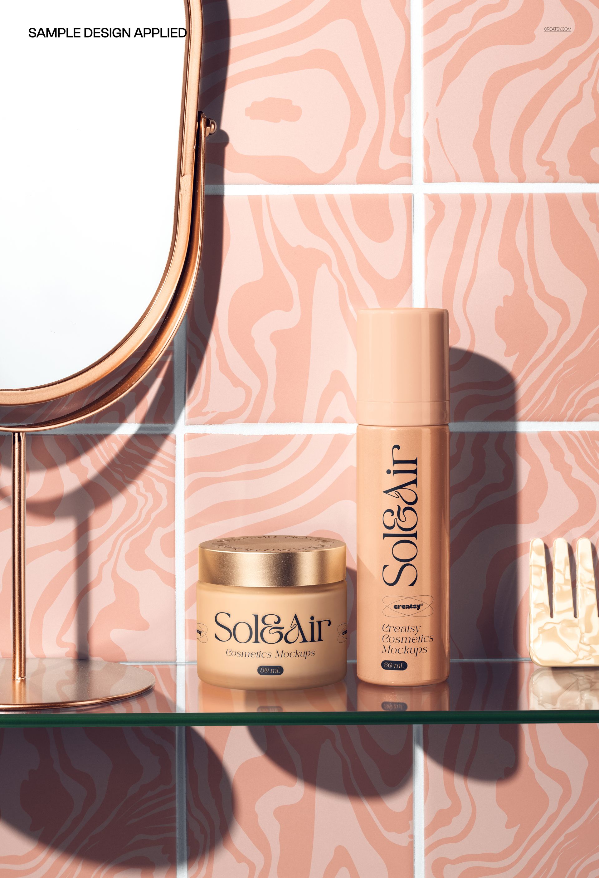 Bathroom skincare products mockup featuring a bottle and jar on a glass shelf against pink tiled wall and mirror.