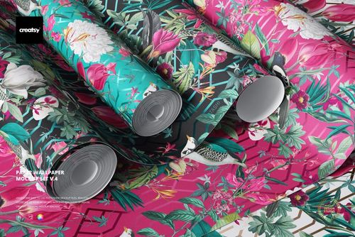 PSD mockup of paper wallpaper rolls with bold floral and foliage prints in bright colors, arranged in a home decor setting.