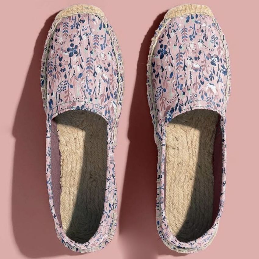 Canvas espadrilles mockup featuring a pair of shoes with a pink background and watercolor floral patterns in blue and purple tones.