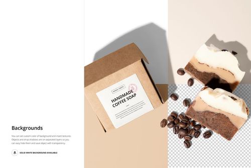 Coffee soap box mockup with a rectangular white label, accompanied by soap slices and coffee beans on a light surface.