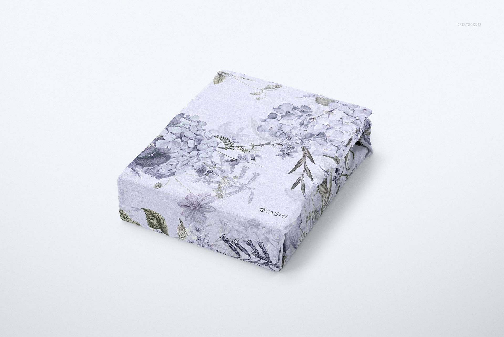 Brushed cotton sheet mockup featuring a folded sheet with subtle botanical design, shown from a front angle.