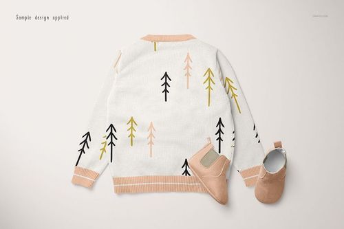 Baby cardigan sweater mockup with a back view, featuring abstract tree patterns in black, yellow, and peach tones.