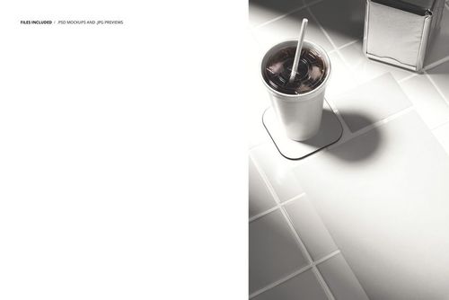 Top view of a paper cup with a straw on a coaster, business card, flyer, and napkins on a tiled surface in a mockup scene.