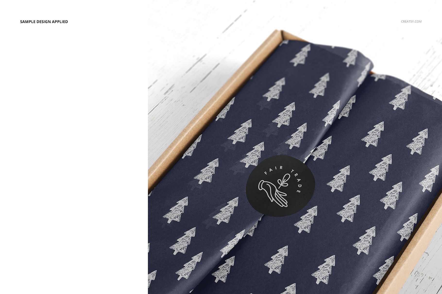 PSD mockup of packaging with a cardboard mailer box and patterned tissue paper, photographed on a white surface.