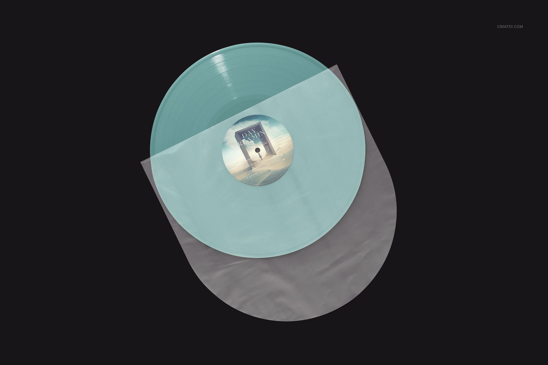 Colored vinyl record mockup displayed from above, half-covered by a clear plastic sleeve on a black surface.