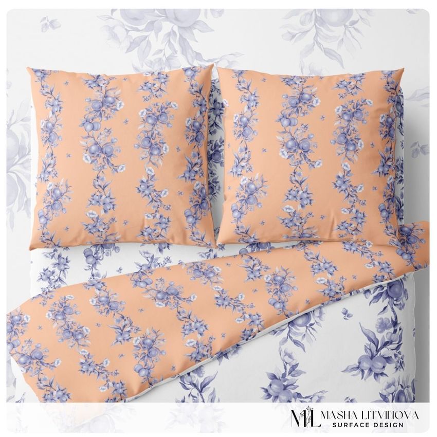 Bedding mockup featuring two euro pillows and a duvet with a blue floral pattern on a peach background, viewed from above.