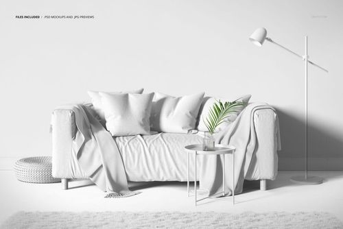PSD mockup showing a contemporary sofa with pillows and throw blanket in a bright, monochromatic living space.