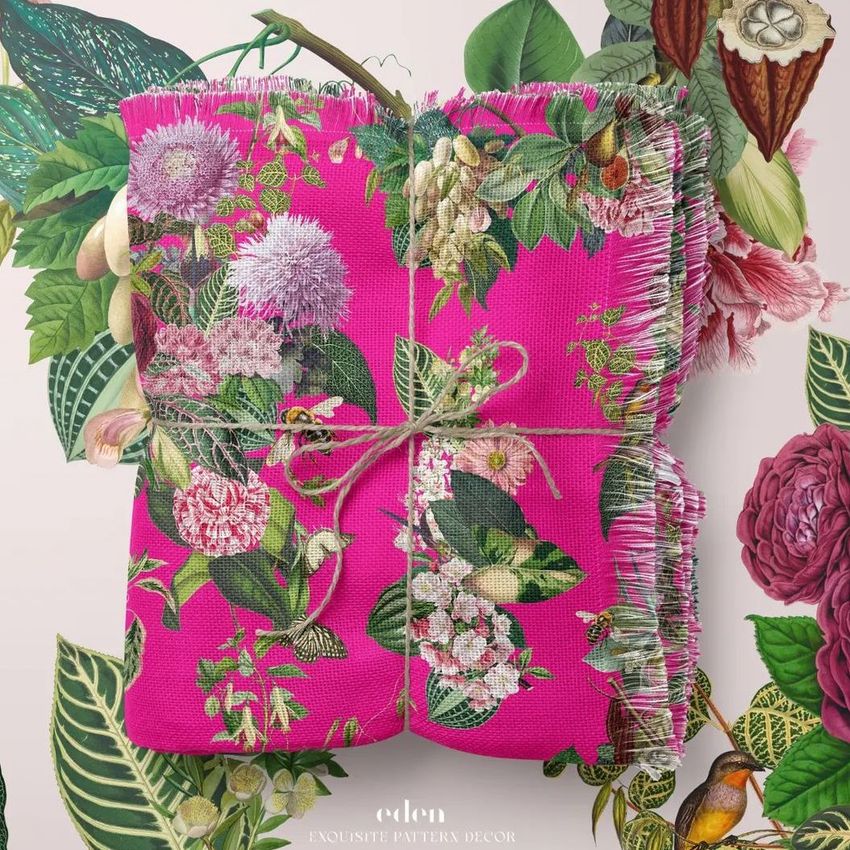 Polyester woven coverlet mockup featuring a folded blanket with a bright pink background and detailed floral pattern, tied with string.