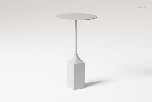 Modern pedestal coffee table with a round top and slender stem, supported by a geometric block base on a light background.