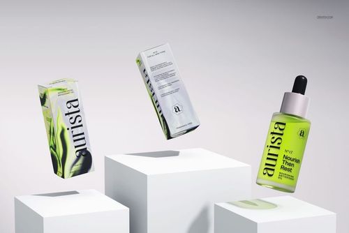 Dropper bottle mockup with green liquid and black cap, displayed alongside two matching cosmetic boxes on white blocks.