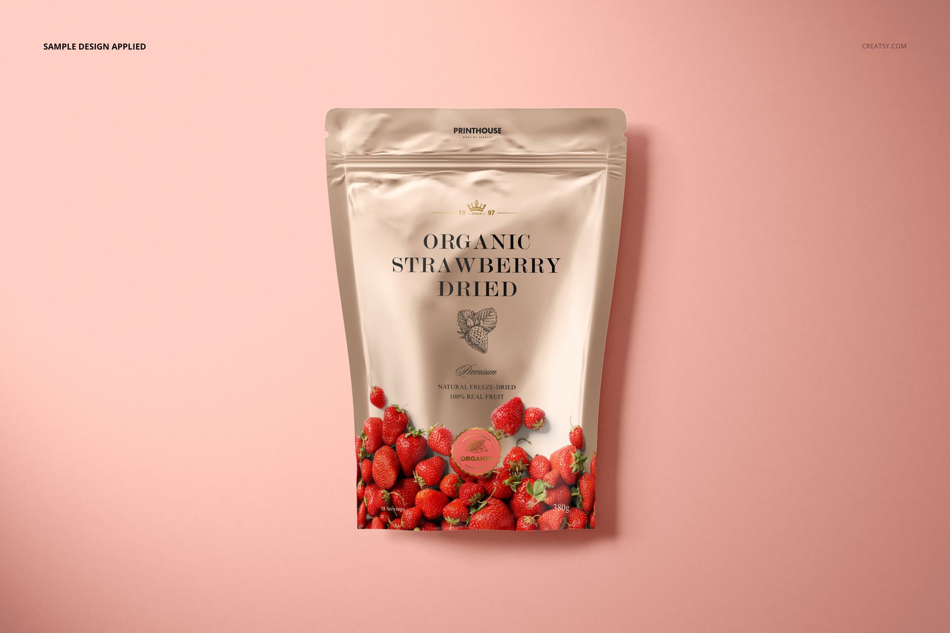 Front view of a metallic zip lock pouch mockup featuring strawberry graphics on a light pink surface.