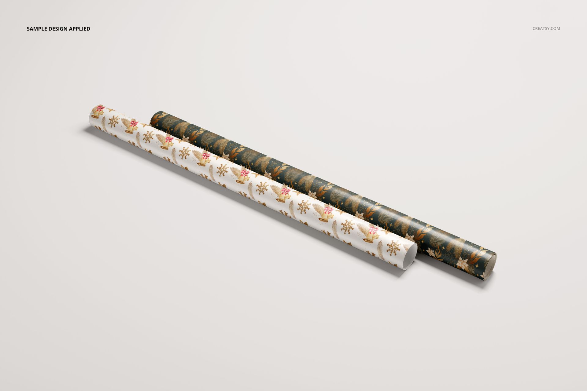 Gift wrapping paper PSD mockup showing two patterned rolls, arranged side by side on a neutral background.