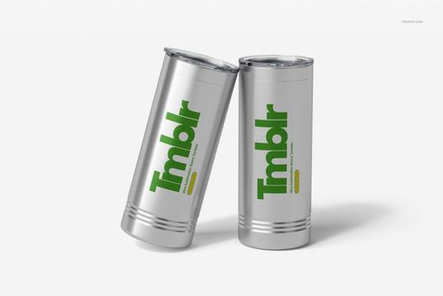 PSD mockup featuring a pair of silver skinny tumblers with green and yellow print, displayed upright on a clean surface.