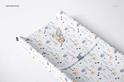 PSD mockup of a rectangular changing pad featuring a soft floral print, displayed at a diagonal top view.