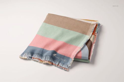 Front view of a striped woven coverlet mockup featuring muted pink, blue, brown, and green bands on a neutral background.