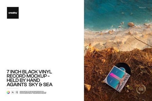 PSD mockup showing a 7 inch black vinyl record with colorful cover on a coastal cliff above ocean waves and sand.