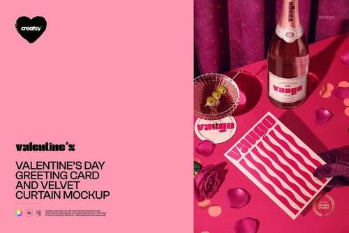 Front view of a Valentine’s Day greeting card mockup on a pink surface with velvet curtain, rose petals, and a bottle.