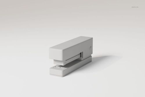 Minimalist desk stapler in light gray color, shown in a front angled view on a plain white background.