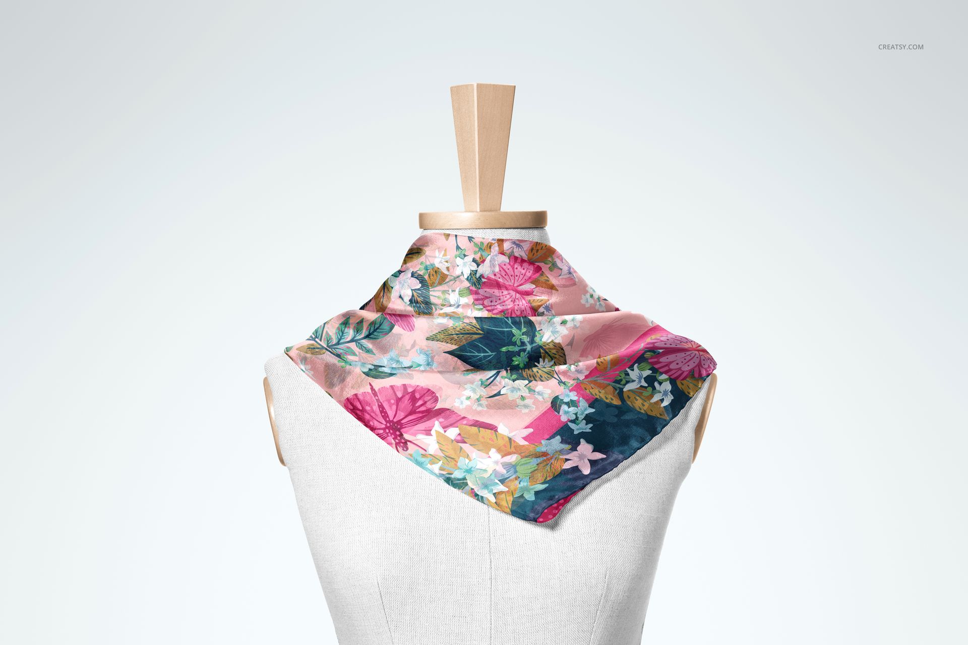 Habotai silk scarf mockup featuring vibrant pink, blue, and green floral design displayed on a mannequin torso.