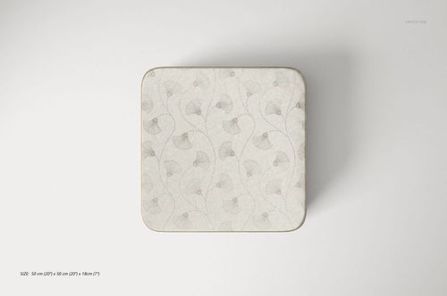 Square pouf mockup with a soft beige leaf motif, displayed from above on a minimalist white background.