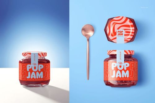 PSD mockup featuring a glass jam jar with orange patterned labeling, displayed next to a metallic spoon on blue background.
