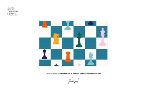 Colorful chess pieces arranged on a blue and white checkered pattern, viewed from above on a flat surface.