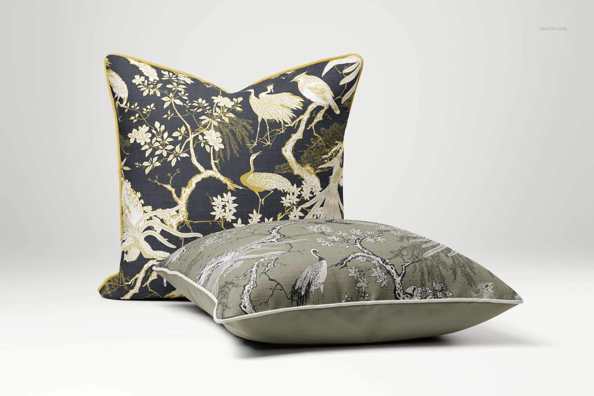 Reversible cushions mockup featuring intricate bird and tree designs, shown in upright and flat positions on a plain background.