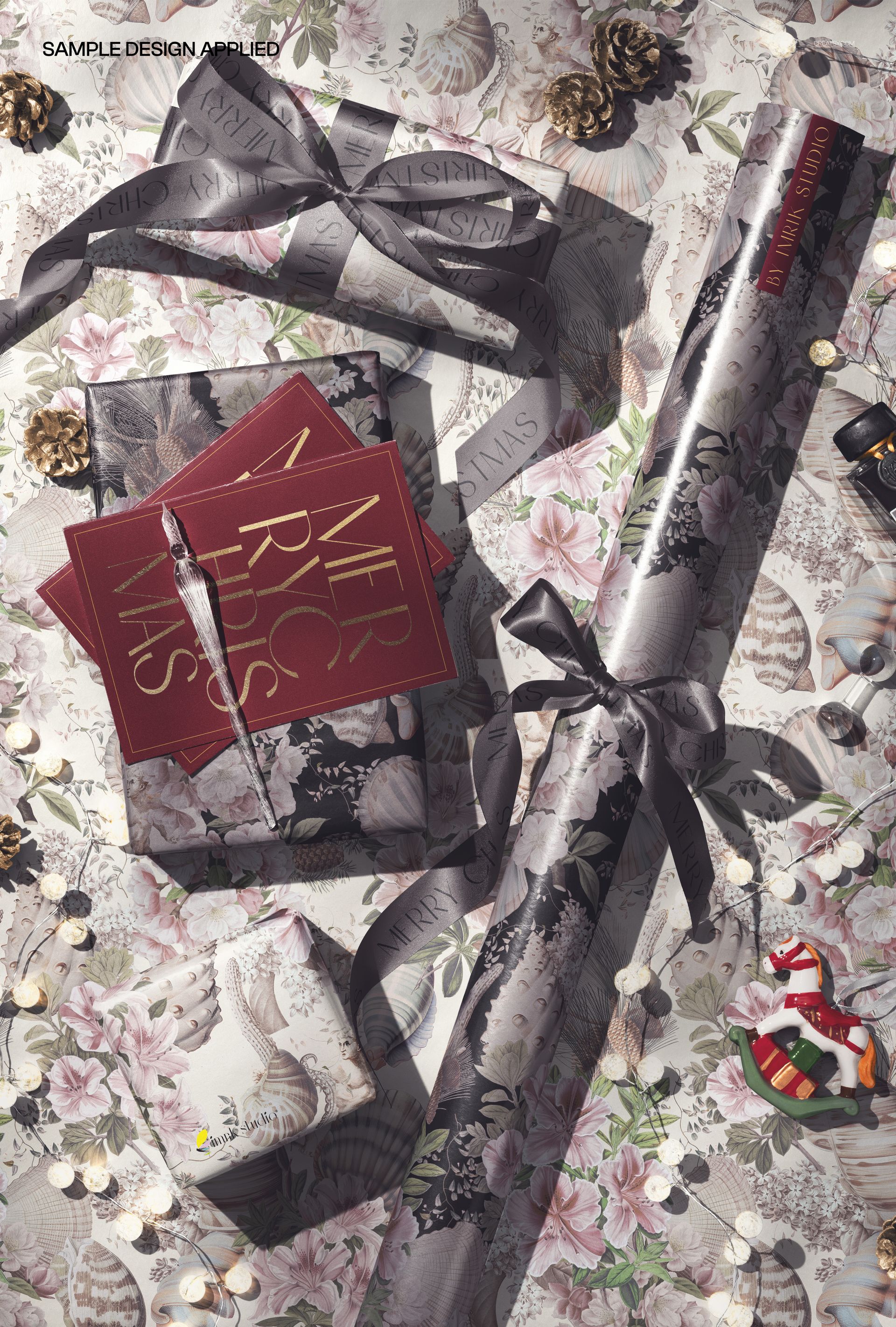 Christmas wrapping paper mockup featuring rolled sheets, wrapped gifts, and greeting cards on a festive surface.