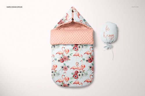 Baby sleeping bag mockup with a hood, decorated with pink flamingos and flowers, shown next to a matching pouch.