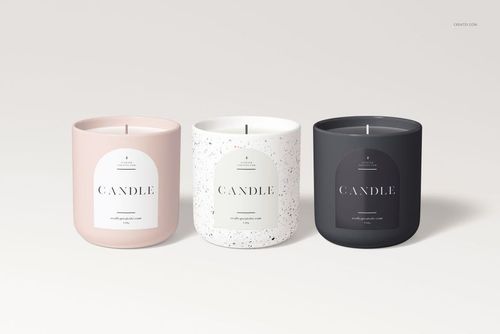 Three Nordic style vessel candles in pastel pink, speckled white, and matte black, shown from the front on a light background.