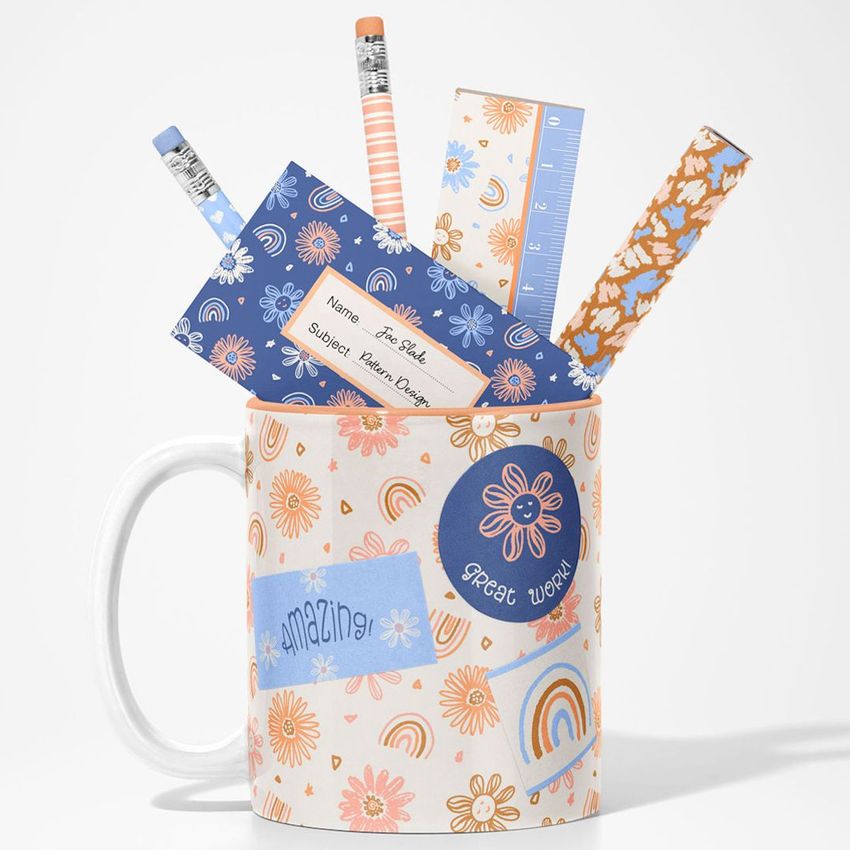 Mug mockup filled with patterned office supplies including pencils, rulers, and paper, set against a plain white background.
